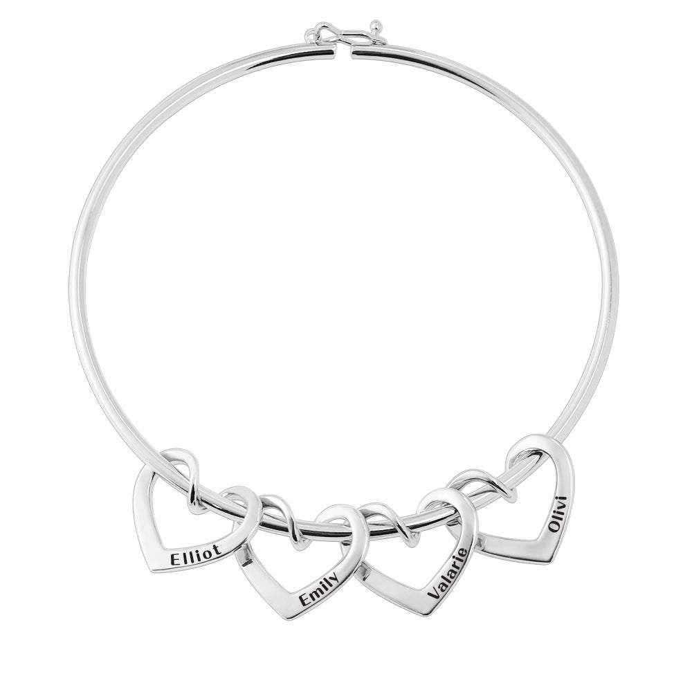 custom bracelet with 4 engraved name heart-shaped rings. silver / butterfly clasp